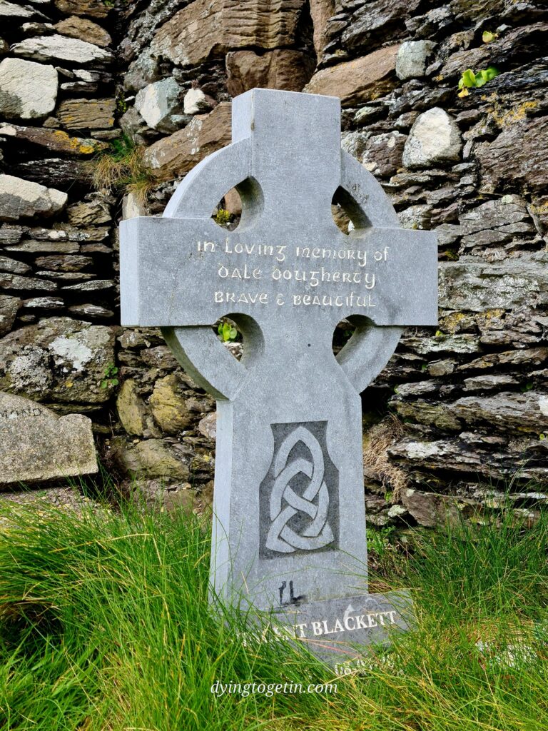 simple celtic cross stone with the inscription - in loving memory of dale dougherty - brave and beautiful. and at the base - Vincent Blackett