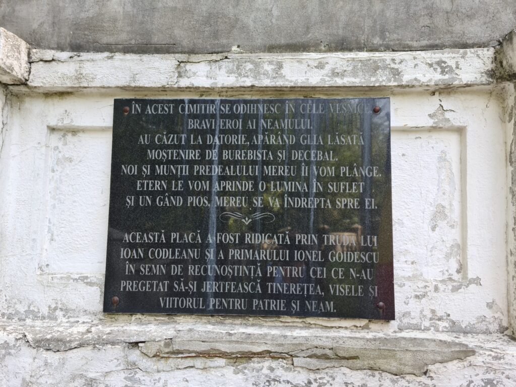 Black marble plaque with inscription in Romanian - translated in the main text